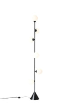 Six-globe vertical opal glass floor lamp, in black on a plain background