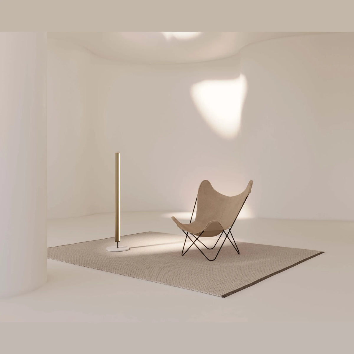 Slim LED column floor lamp with marble base, in a minimal room