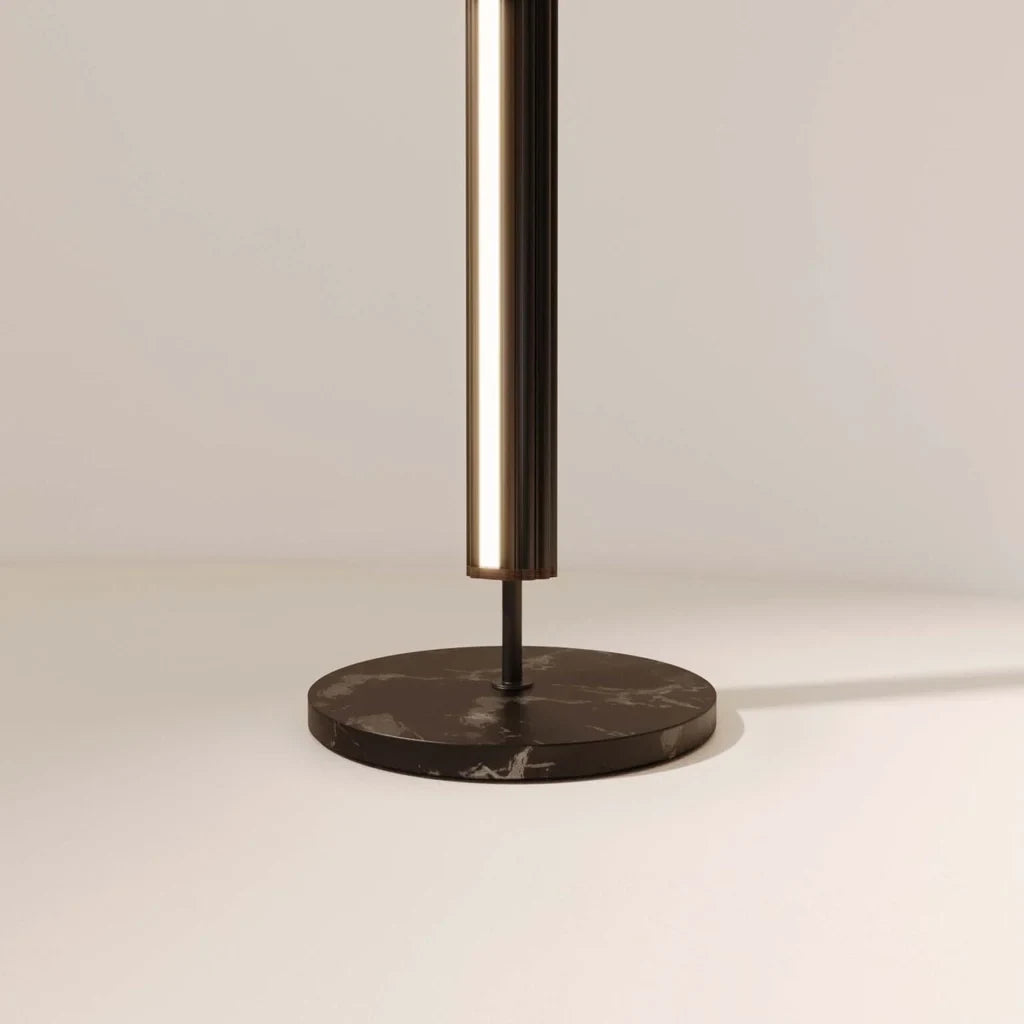 Slim LED column floor lamp with marble base, close-up of the black marble base