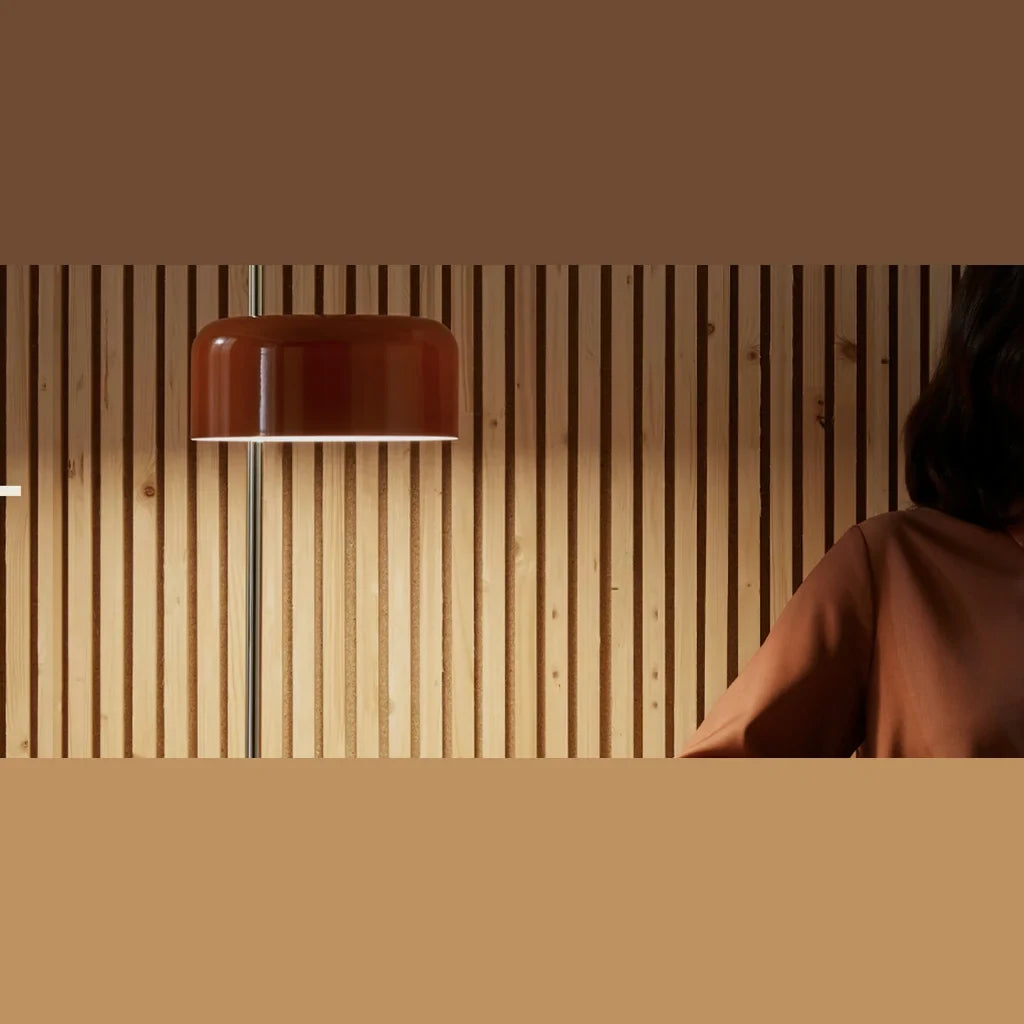 Slim stem table lamp with domed disc shade, in rust red, close view