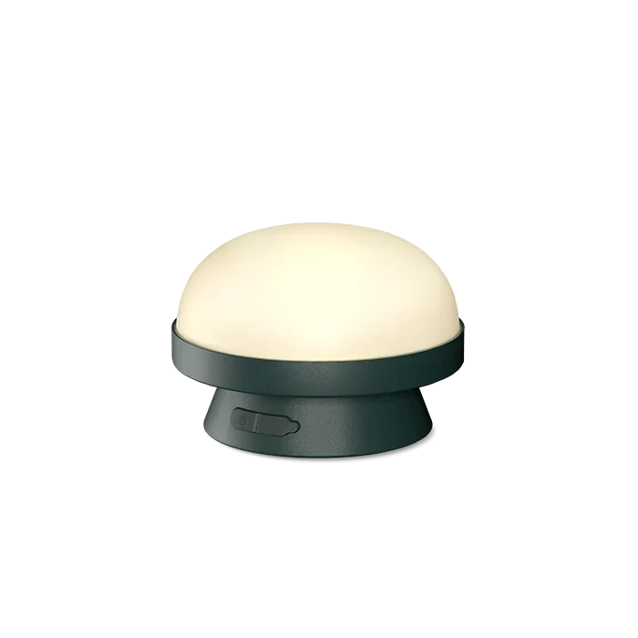 Cordless solar dome table lamp in forest green, lit