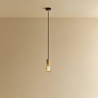 Squirrel Cage Filament Bulb Pendant, in oak, lit, against a plain wall