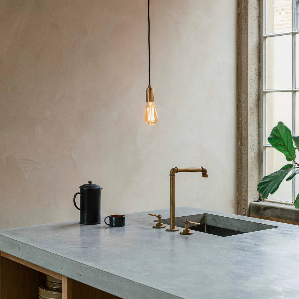 Squirrel cage filament plug-in pendant, above a kitchen sink