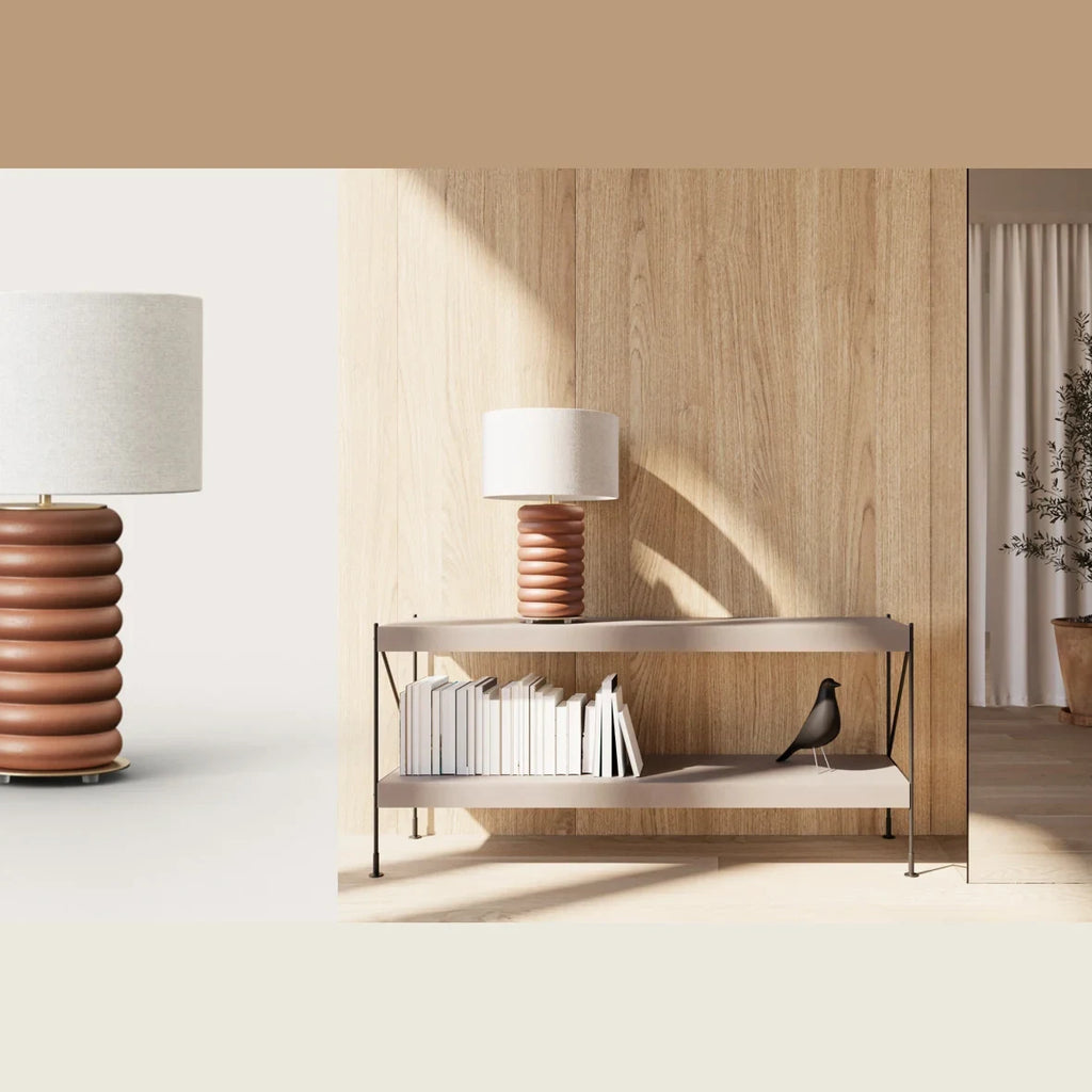 Stacked ceramic rings table lamp, on a console table in a living room