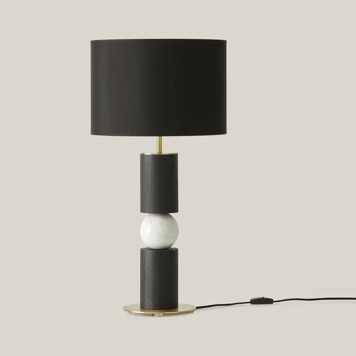 Stacked wood and marble sphere table lamp base, in black and white, shown with a black shade (sold separately)