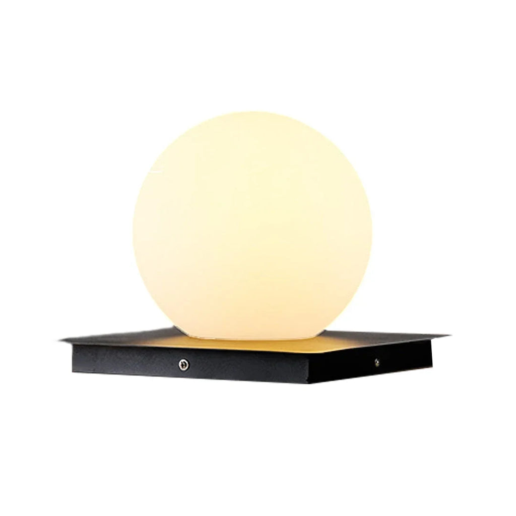 Outdoor pillar light, globe shade, lit