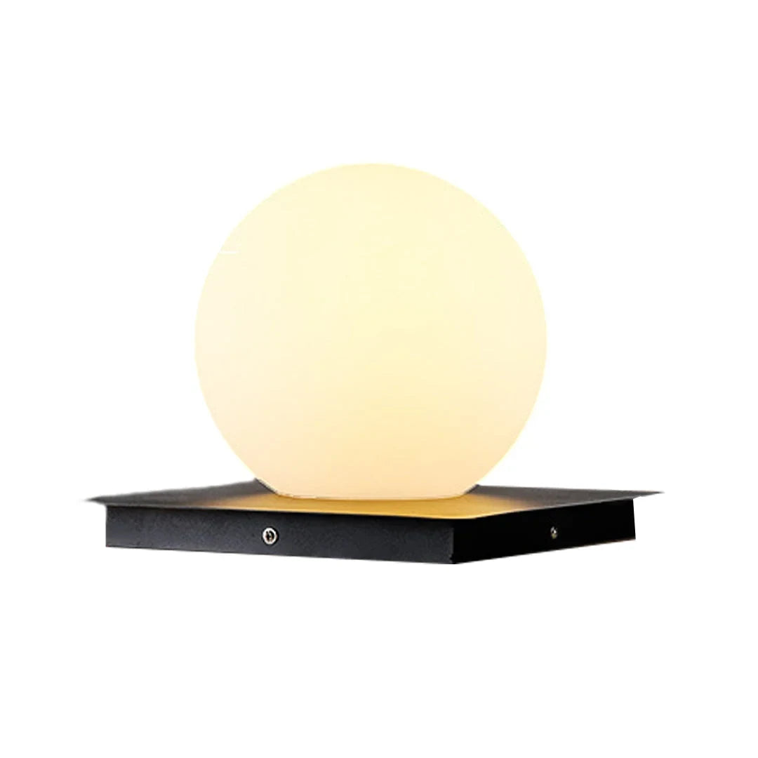 Outdoor pillar light, globe shade, lit