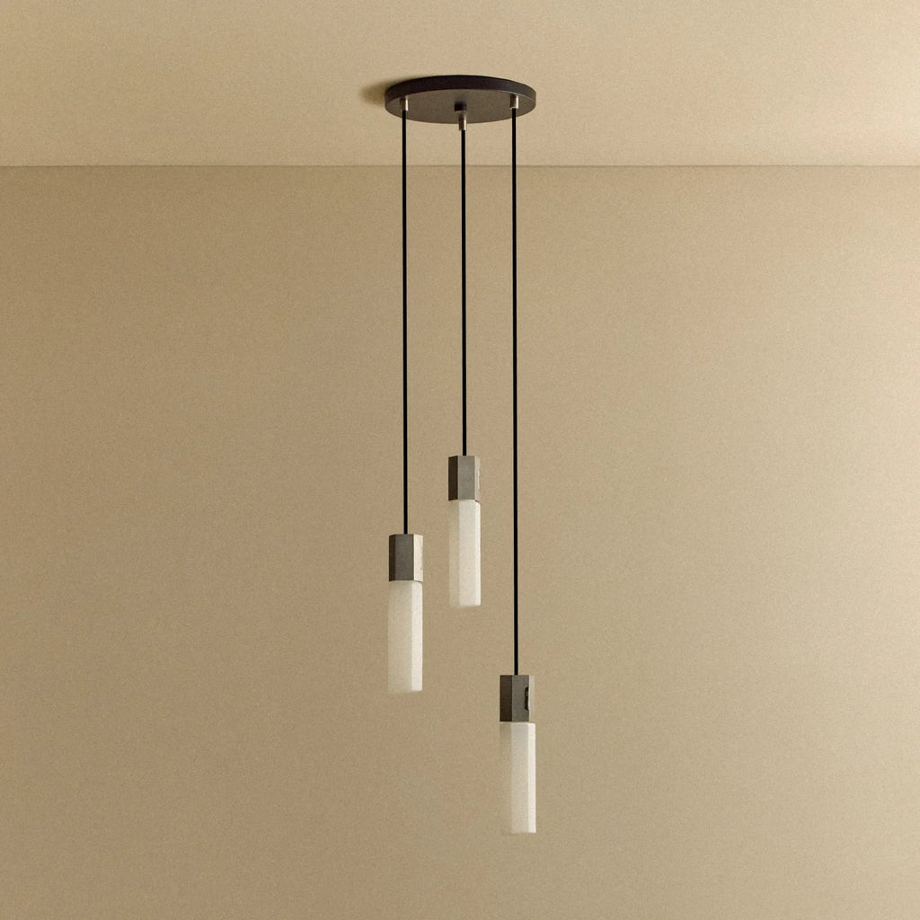Three-drop cluster pendant in cast stainless steel with glass bulbs, unlit