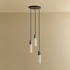 Three-drop cluster pendant in cast stainless steel with glass bulbs, unlit
