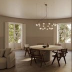 Striped diffuser ring chandelier, above a round dining table