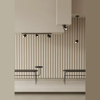 Swivel spot ceiling light, in a panelled interior