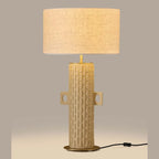 Tall hand-painted ceramic column table lamp, lit, with a linen shade (sold separately)