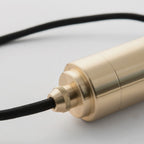 Tall tinted bulb plug-in pendant, close-up of the brass holder