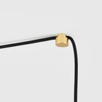 Tall tinted bulb plug-in pendant, brass cable node on the cable