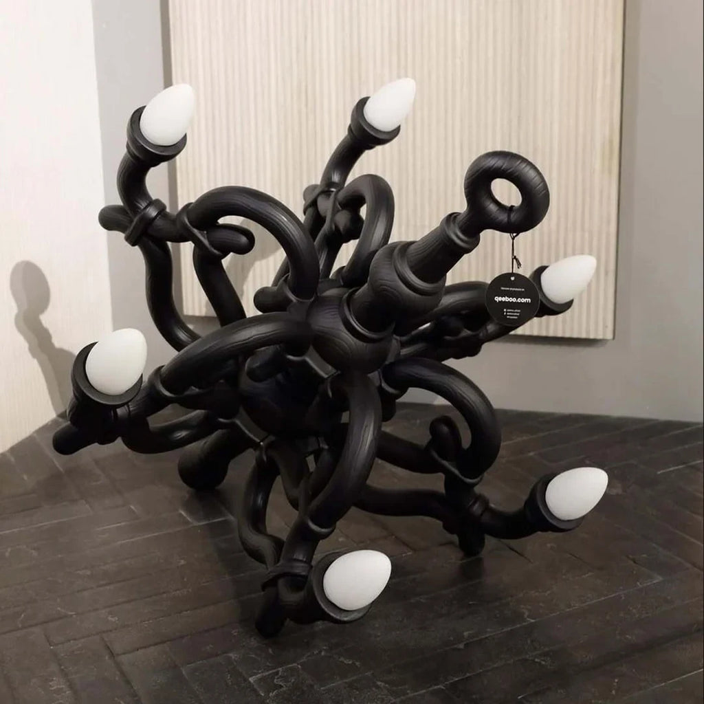 Tangled arm XL floor chandelier, in black in a room