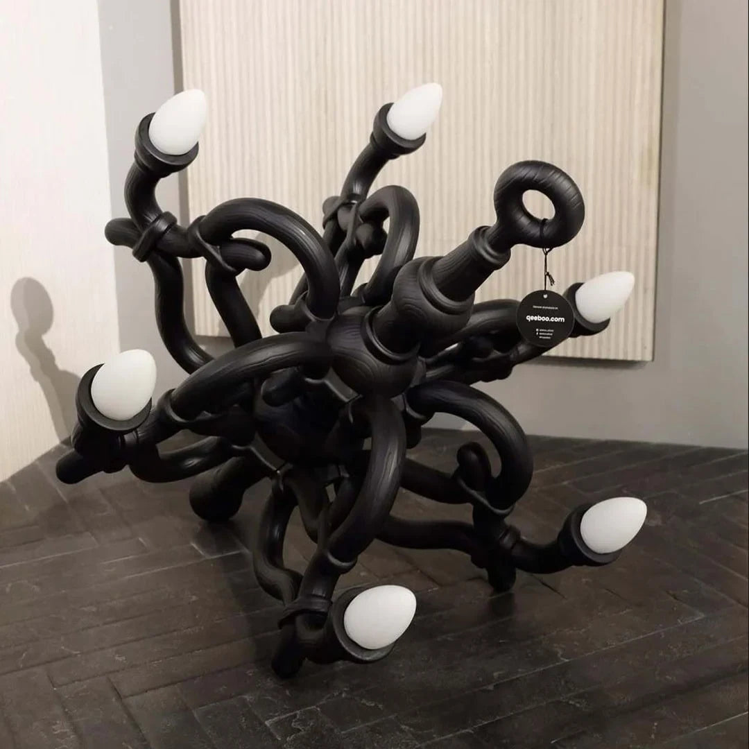 Tangled arm XL floor chandelier, in black in a room