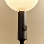 Graphite telescopic floor lamp, close-up of the stem and control