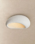 Textured pebble flush ceiling light, in white