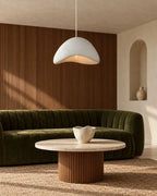 Textured sculptural pendant light, wavy shape in white, in a living room