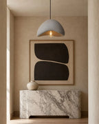 Textured sculptural pendant light, in grey in a hallway