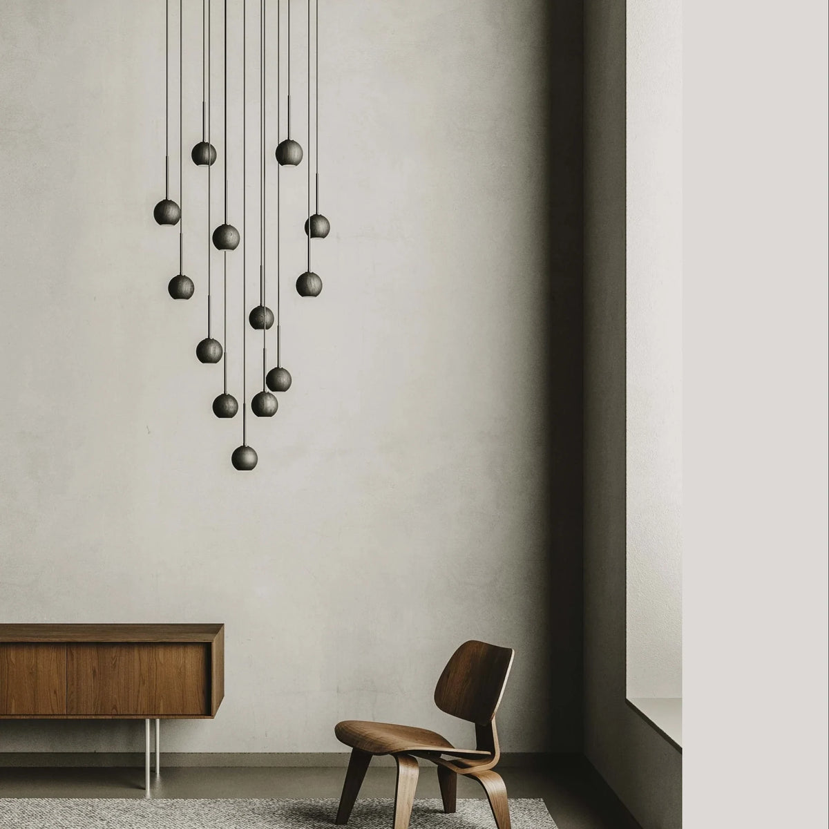 Thirteen-globe cluster LED pendant, in a tall room