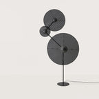 Three-holder floor lamp with angled arm, shown with optional discs (not included)