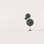 Three-holder floor lamp with angled arm, shown with optional discs (not included), second view