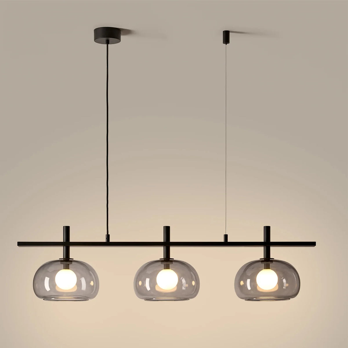 Three layered glass dome linear pendant, in grey glass, lit
