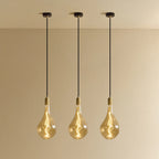 Tinted Elongated Bulb Pendant, Set of 3, Brass, three pendants lit in a row