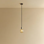 Tinted globe bulb pendant, in stainless steel against a plain wall