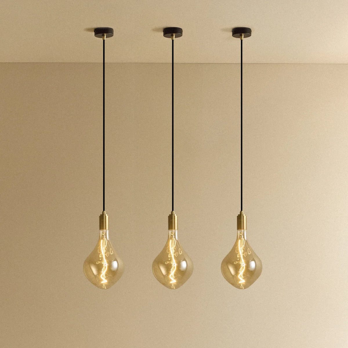Tinted Sculptural Bulb Pendant, Set of 3, Brass, three pendants lit in a row