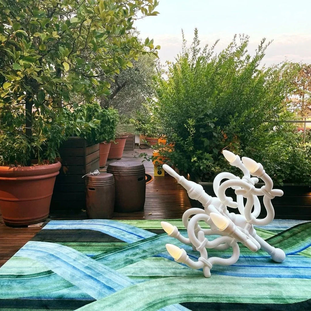 Toppled chandelier cordless lamp, white, on a terrace