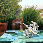 Toppled chandelier cordless lamp, white, on a terrace