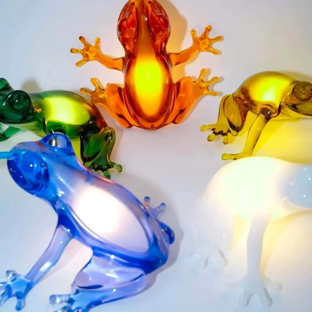Translucent frog table lamp, four colours together, lit