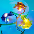 Translucent frog table lamp, three frogs in blue, yellow and orange