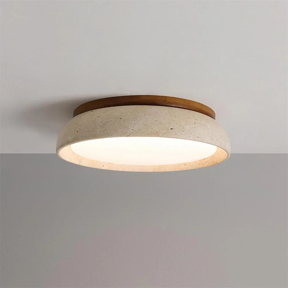 Travertine and wood flush ceiling light, lit on a ceiling