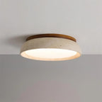 Travertine and wood flush ceiling light, lit on a ceiling