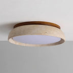 Travertine and wood flush ceiling light, lit on a ceiling