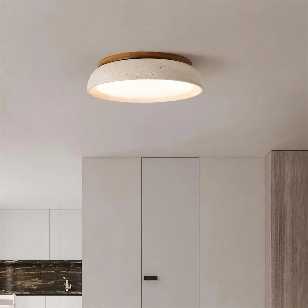 Travertine and wood flush ceiling light, lit on a ceiling