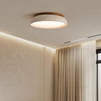 Travertine and wood flush ceiling light, lit on a ceiling