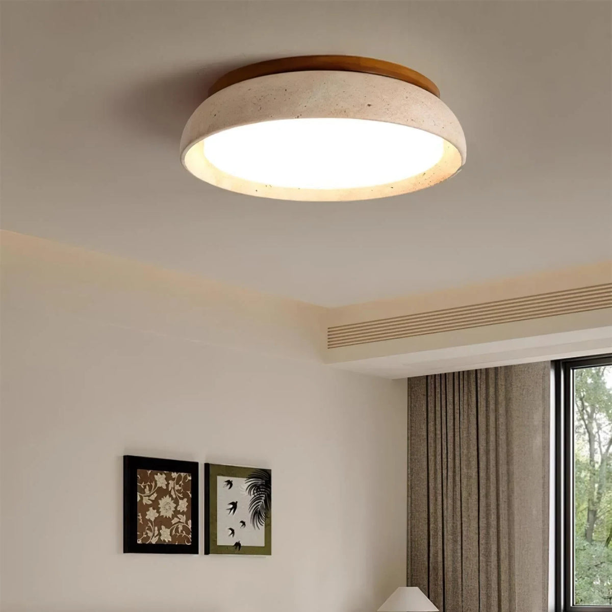 Travertine and wood flush ceiling light, lit on a ceiling