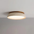 Travertine and wood flush ceiling light, lit on a ceiling