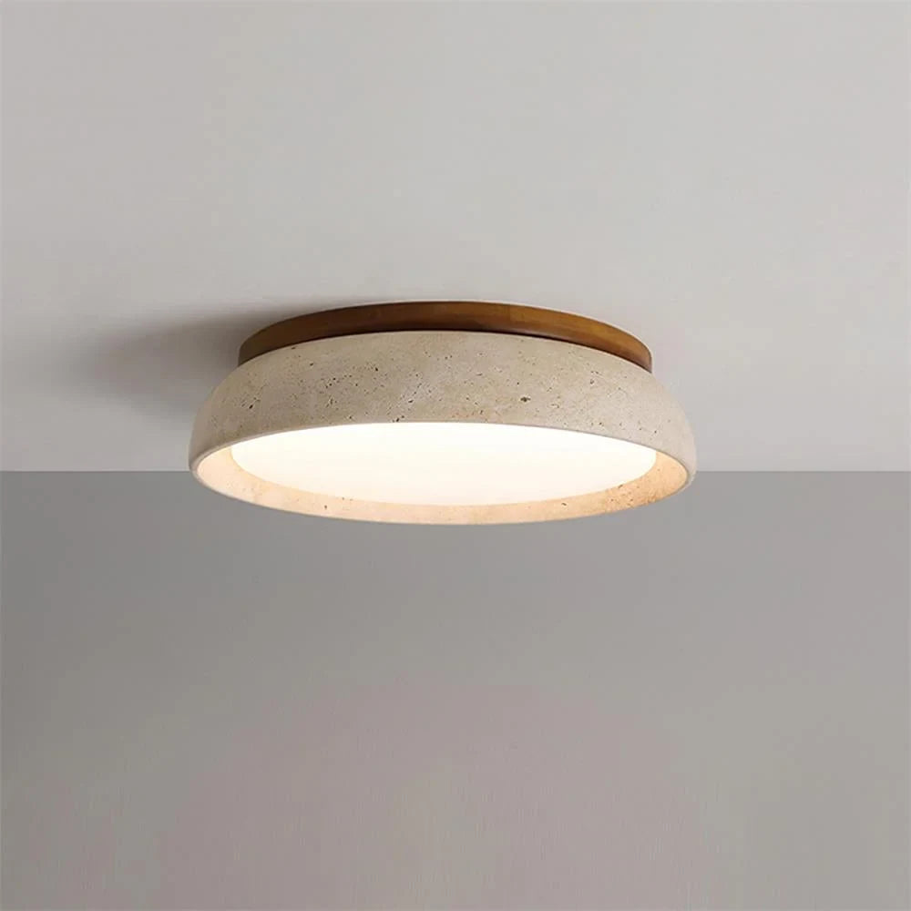 Travertine and wood flush ceiling light, lit on a ceiling