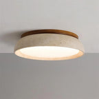 Travertine and wood flush ceiling light, lit on a ceiling