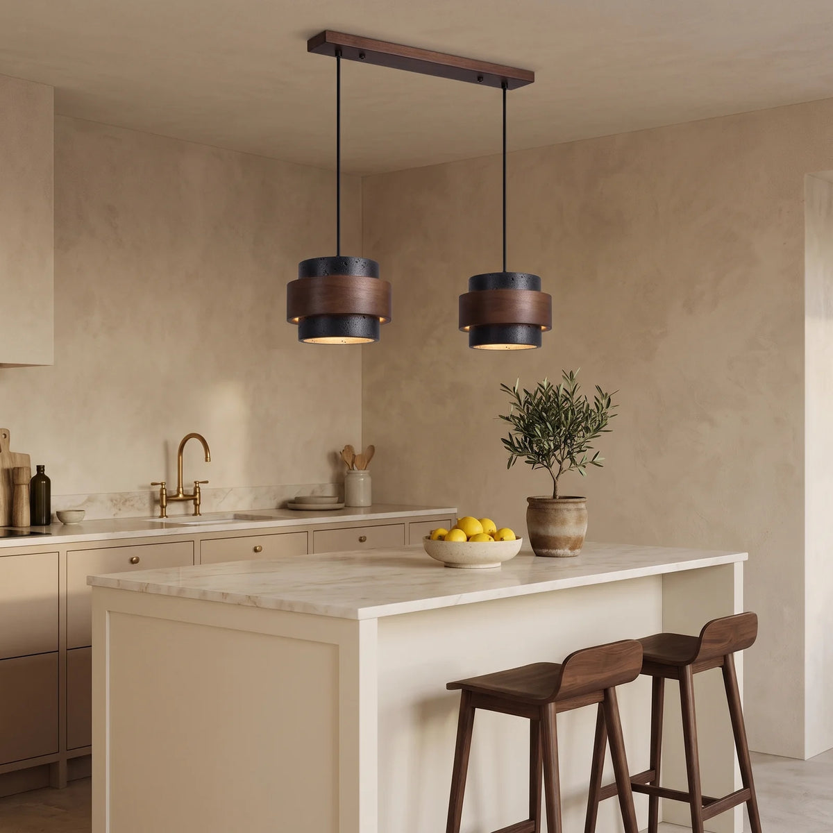 Two black travertine and walnut drum pendants over a kitchen island