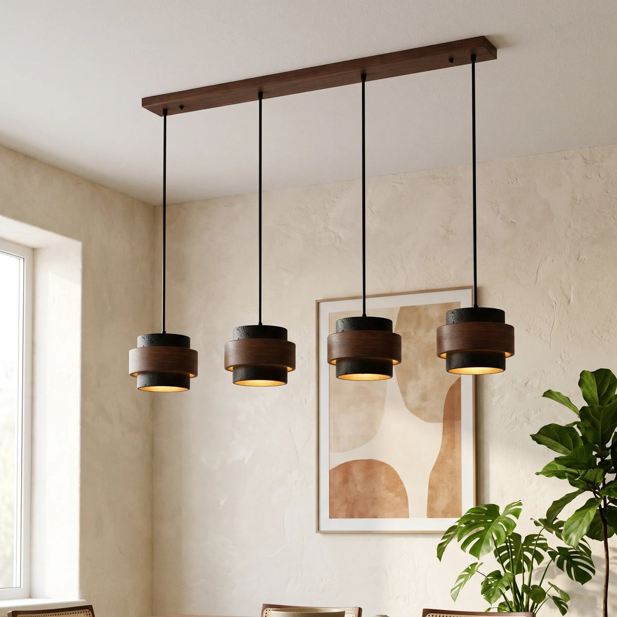 Four black travertine and walnut drum pendants on a walnut bar