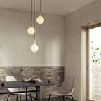 Triple opal sphere cluster pendant, above a dining table