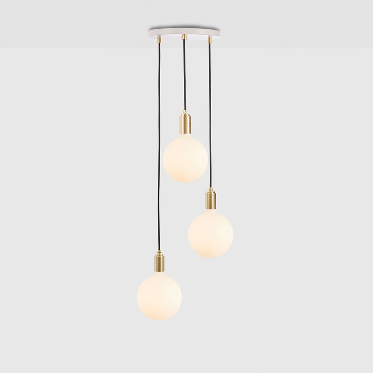 Triple opal sphere cluster pendant, with white canopy on a grey background