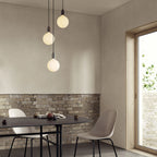 Triple Opal Sphere Cluster Pendant, above a dining table