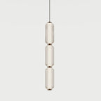 Triple ribbed capsule column LED pendant, with matte black details